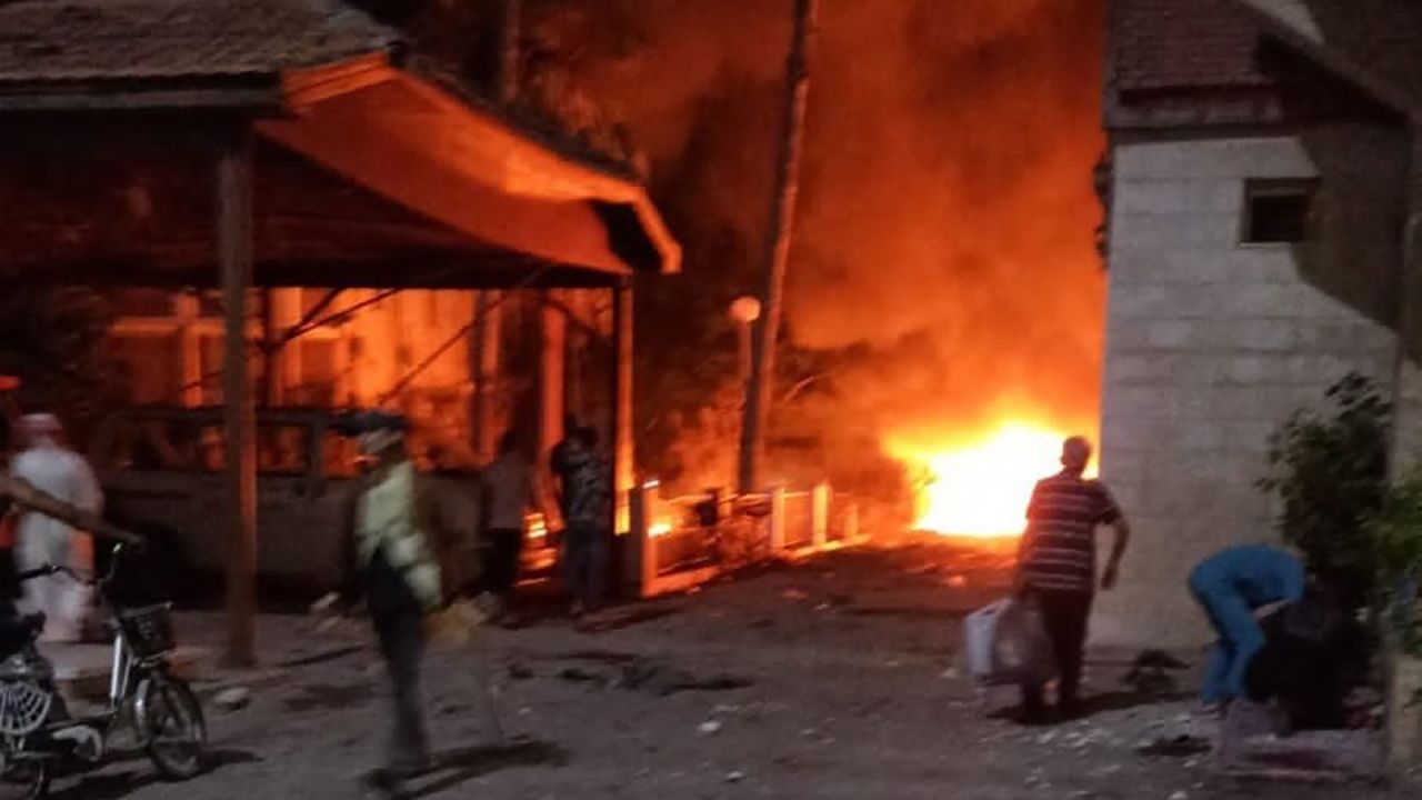 A fire burns in the vicinity of where the hospital blast took place. 