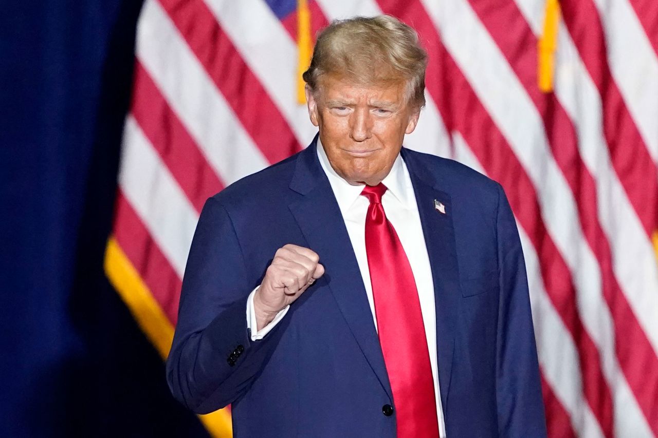 Republican presidential candidate former President Donald Trump arrives to speak at a caucus night party in Des Moines on Monday.