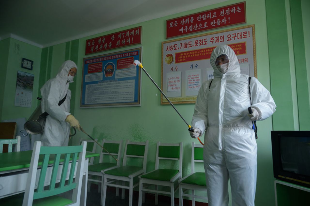 Health officials disinfect an office room amid concerns over the coronavirus at the Pyongchon District People's Hospital in Pyongyang on April 1.