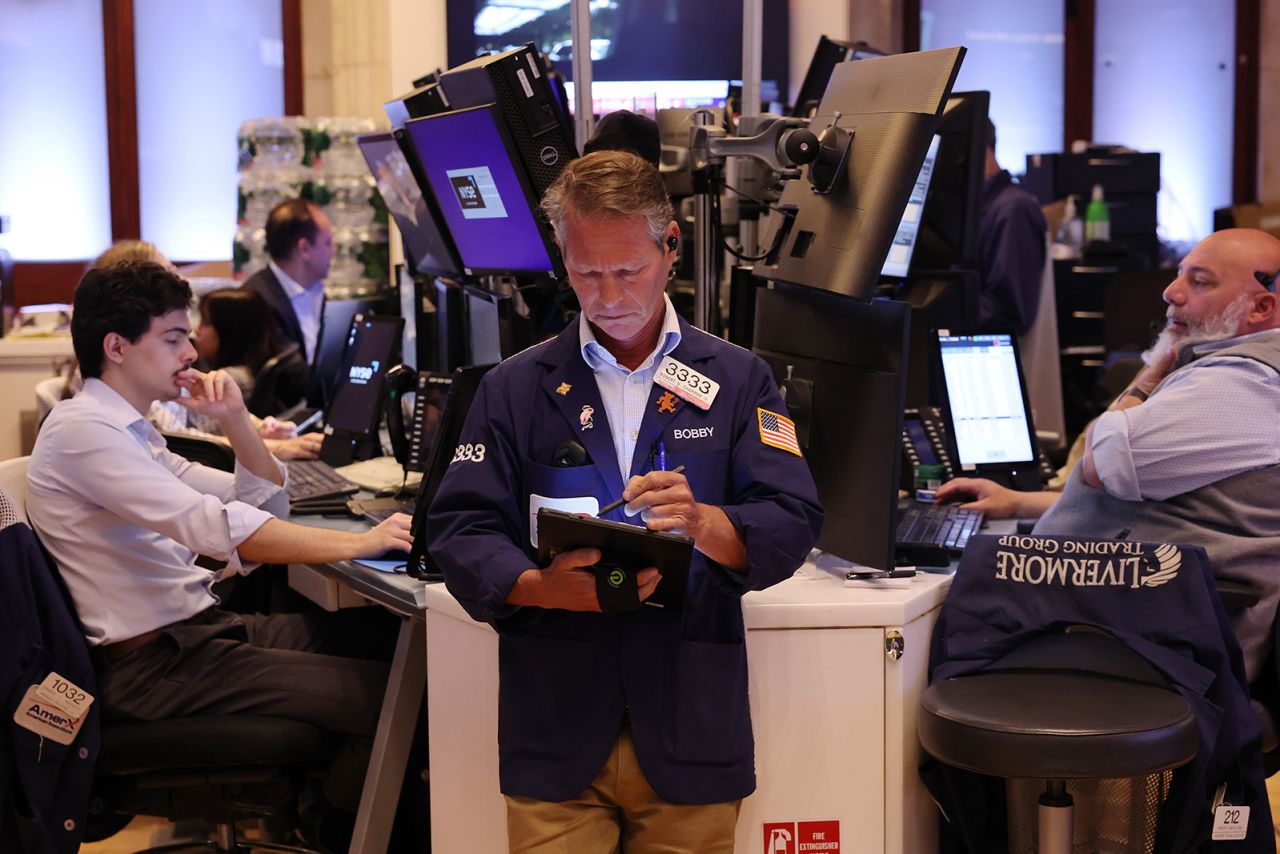 Traders work on the floor of the New York Stock Exchange during afternoon trading on June 3 in New York City. 