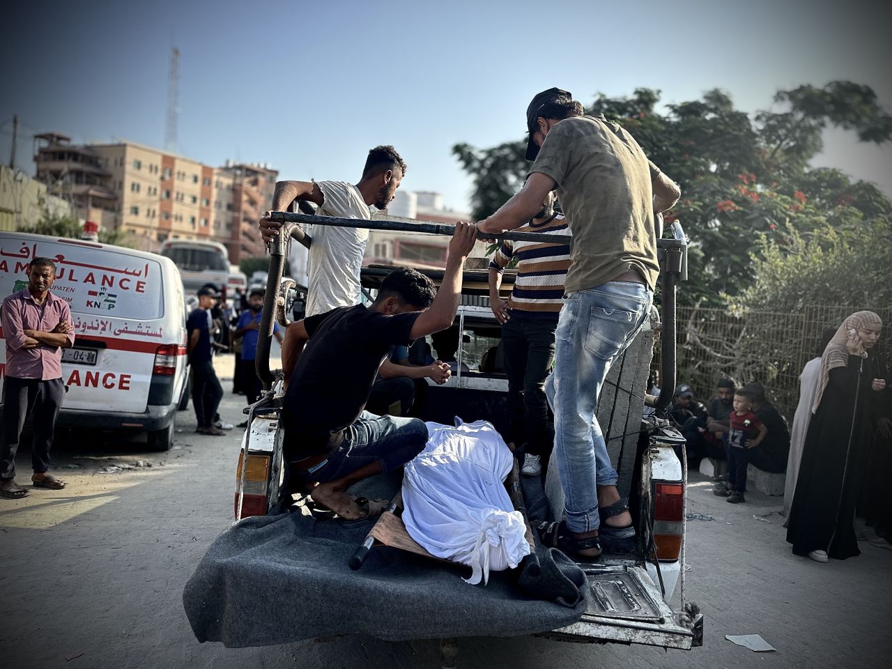 Dead bodies of the Palestinians who died as a result of Israeli airstrikes on a tent encampment are brought to the Nasser Hospital in Gaza to be buried on September 10.