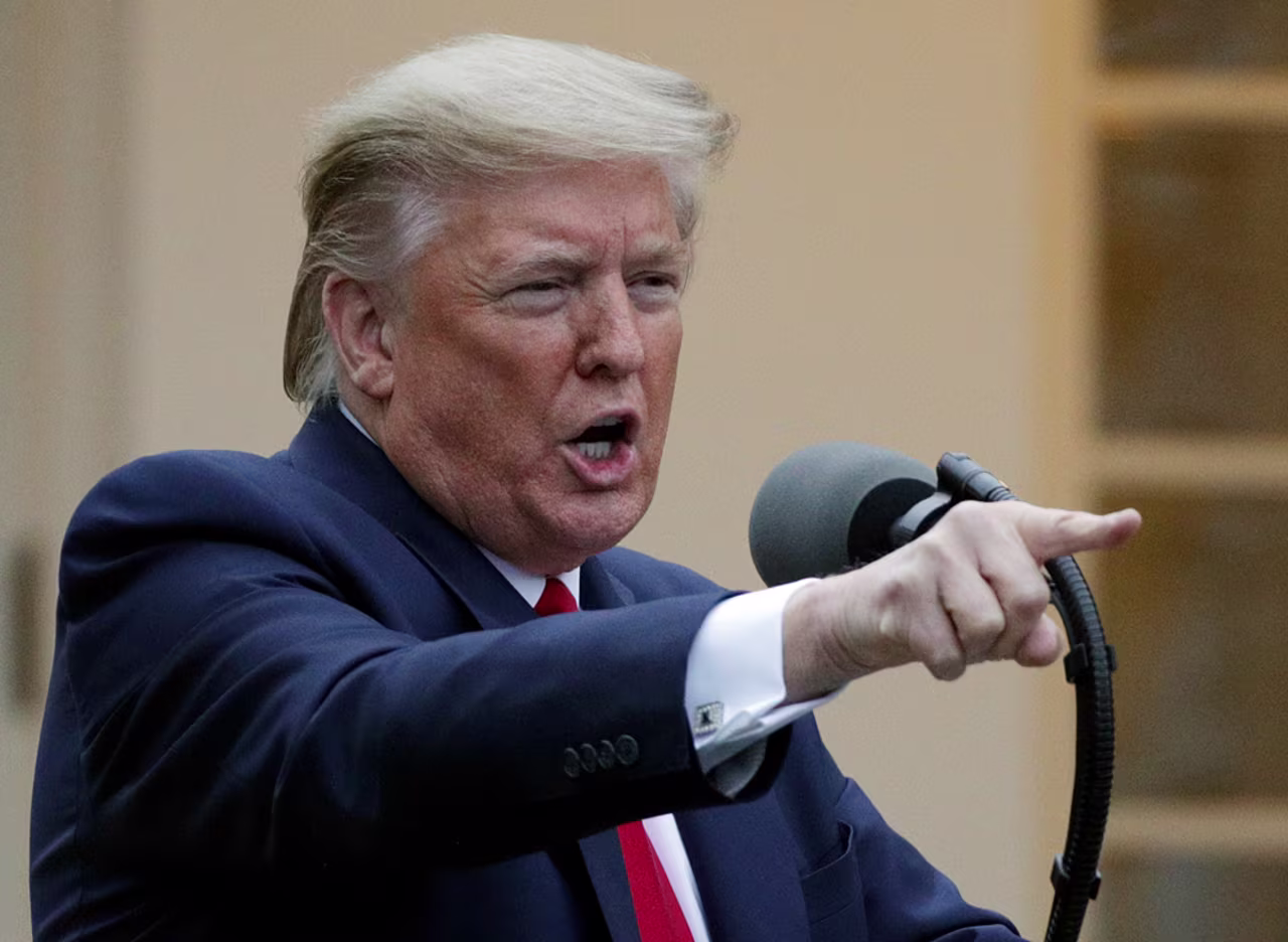 US President Donald Trump speaks during the daily briefing of the White House Coronavirus Task Force in the Rose Garden at the White House April 14 in Washington.