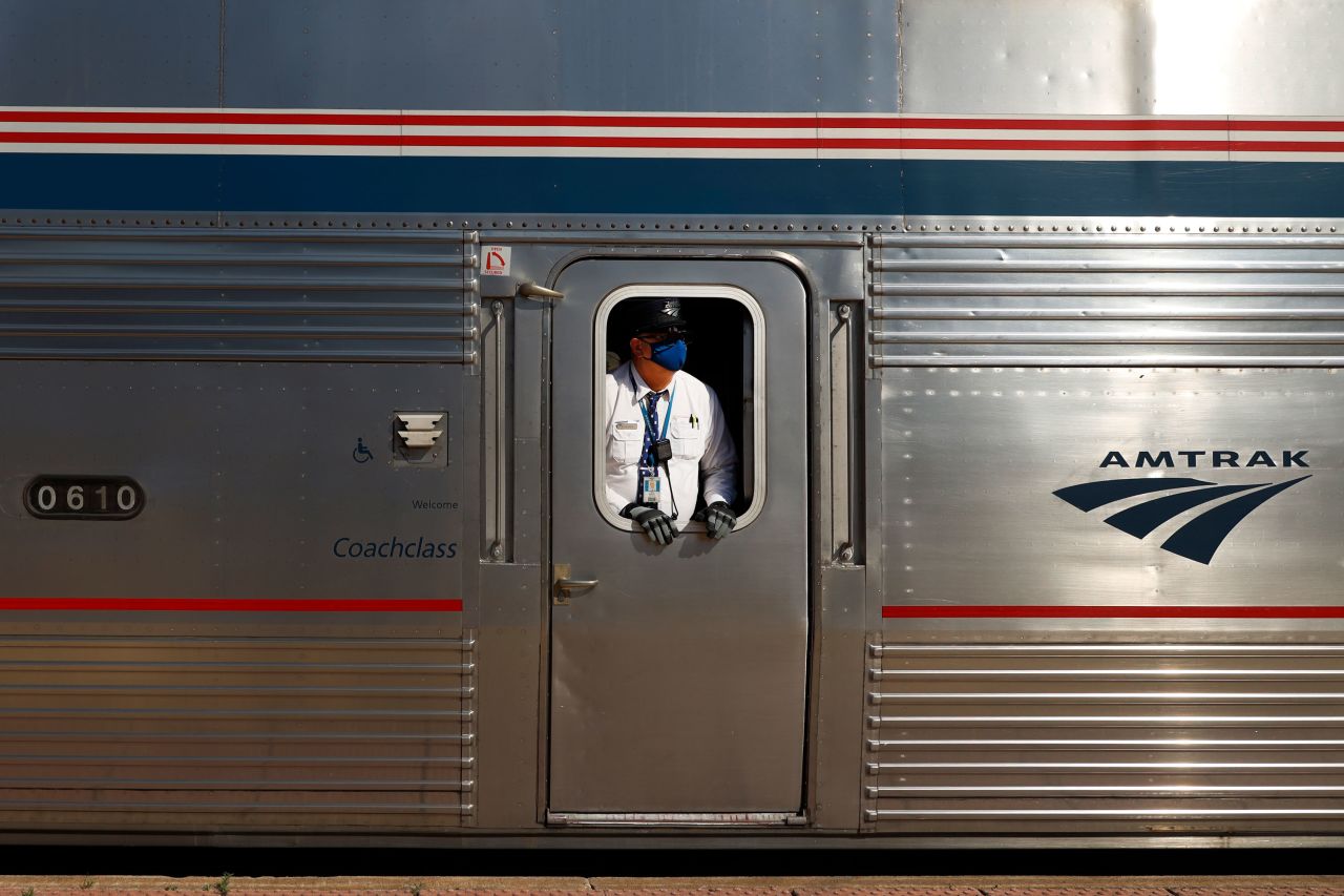 An Amtrak conductor looks down the train platform at the Galesburg, Illinois, station on June 15.