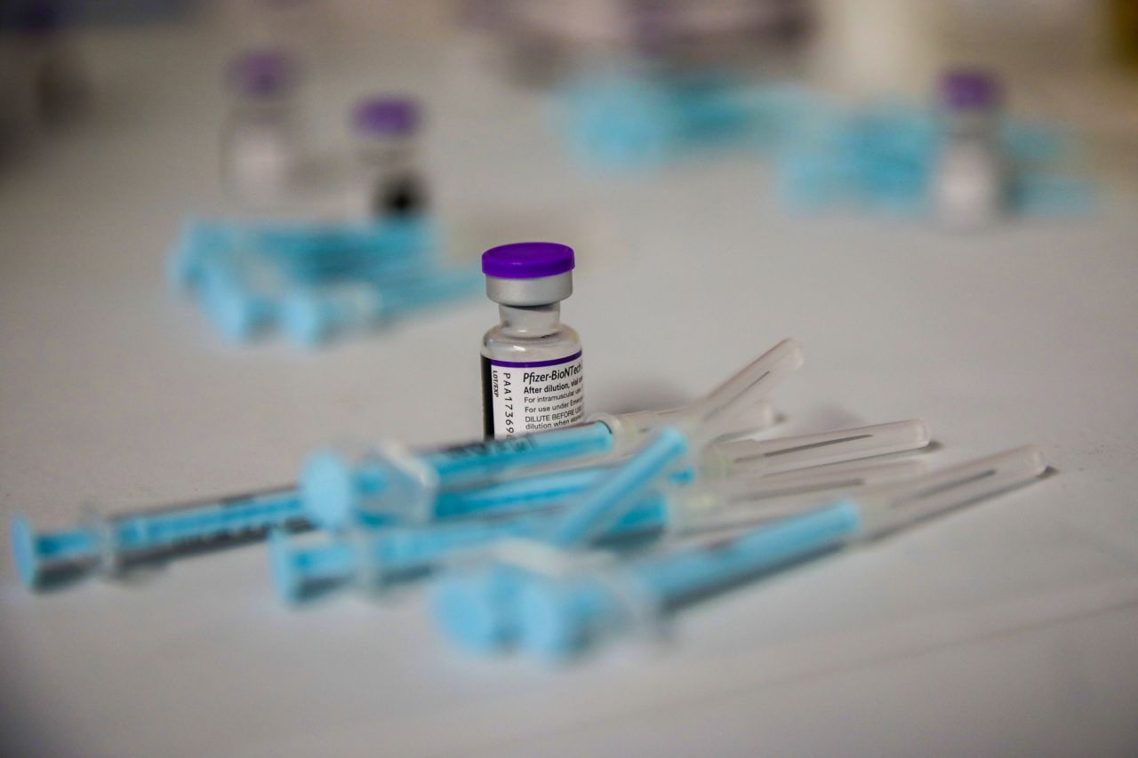 A vial and prepared doses of the Pfizer-BioNTech Covid-19 vaccine at the Grassy Park civic center in Cape Town, South Africa, on Nov. 30, 2021.?