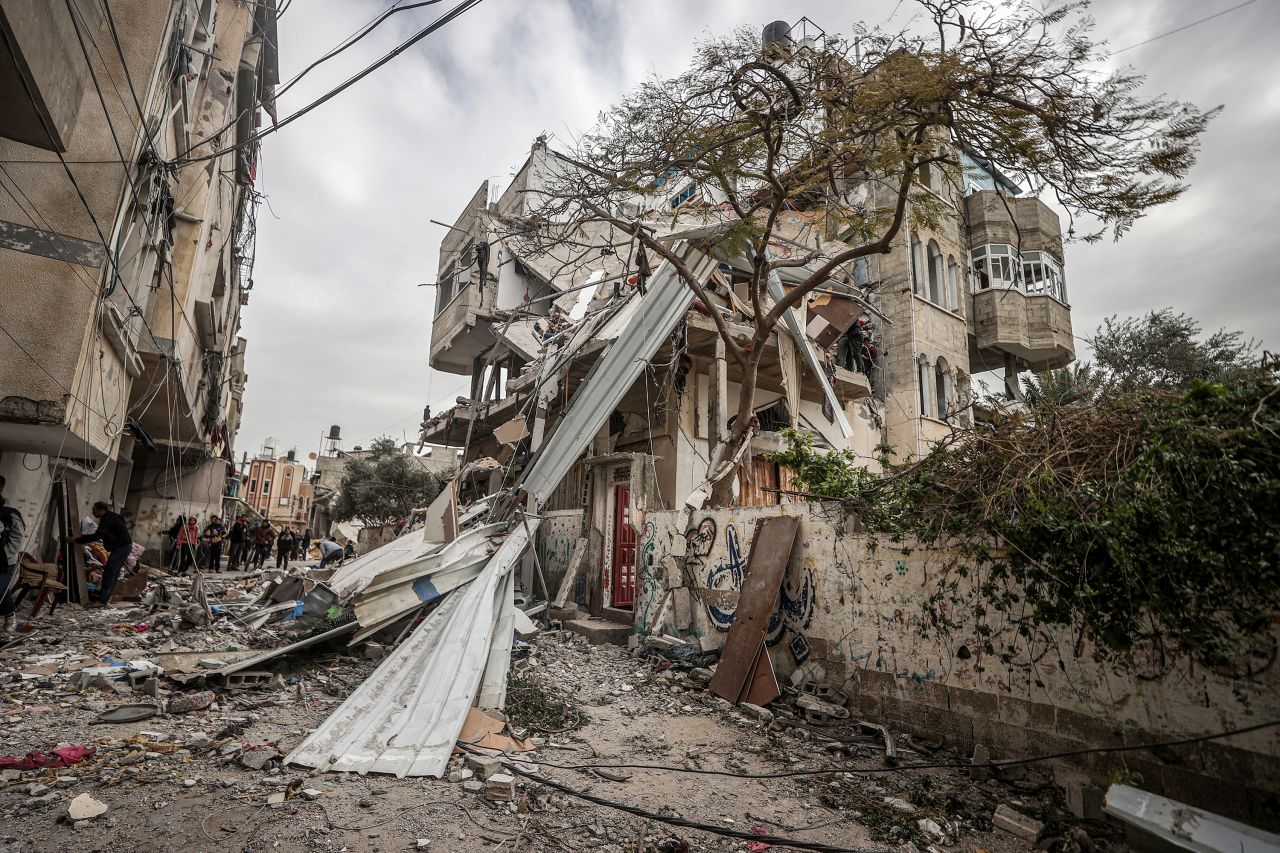 Residents and civil defense teams conduct search and rescue operation around the rubble of the building following an Israeli attack on house belonging to Khalifa family at the Nuseirat refugee camp in Deir al-Balah, Gaza on December 23.