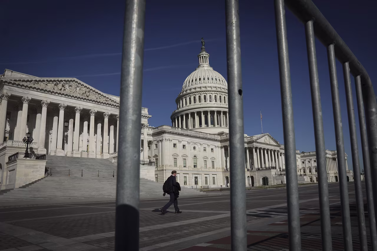 Pedestrians walk outside the U.S. Capitol on March 21 in Washington, DC.