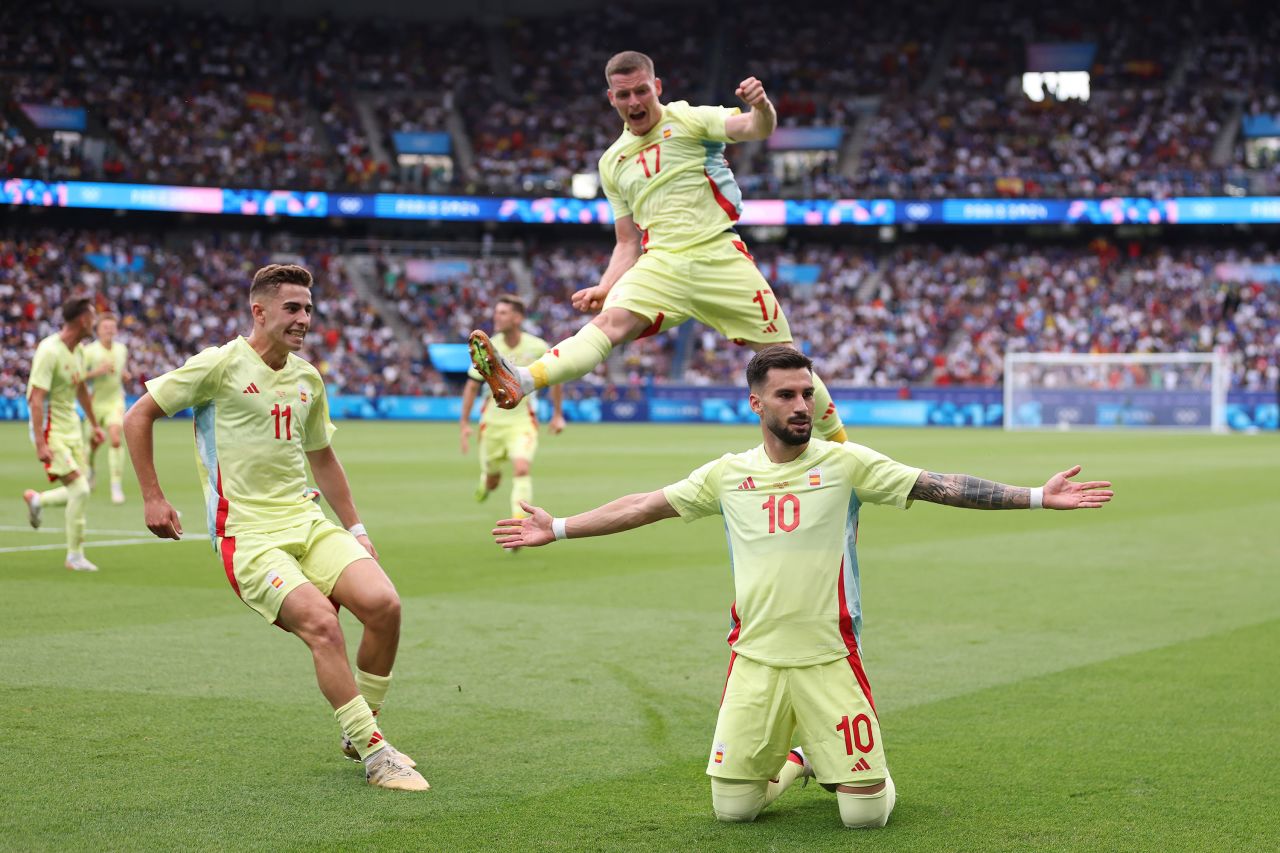 Spain's Álex Baena (No. 10) celebrates after scoring a goal to put his team up 3-1 in the soccer final against France on August 9. France fought back to tie the match and force extra time, but Spain went on to win 5-3. 