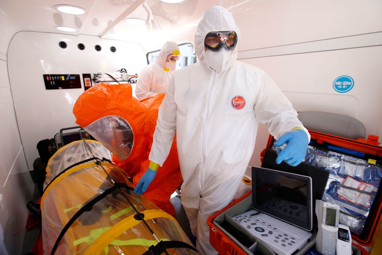 A doctor and paramedics from the Emergency Medical Care System of Jalisco stand inside the mobile intensive care medical unit, the first in Latin America equipped to transfer people infected with coronavirus, in Guadalajara, Mexico on March 2.