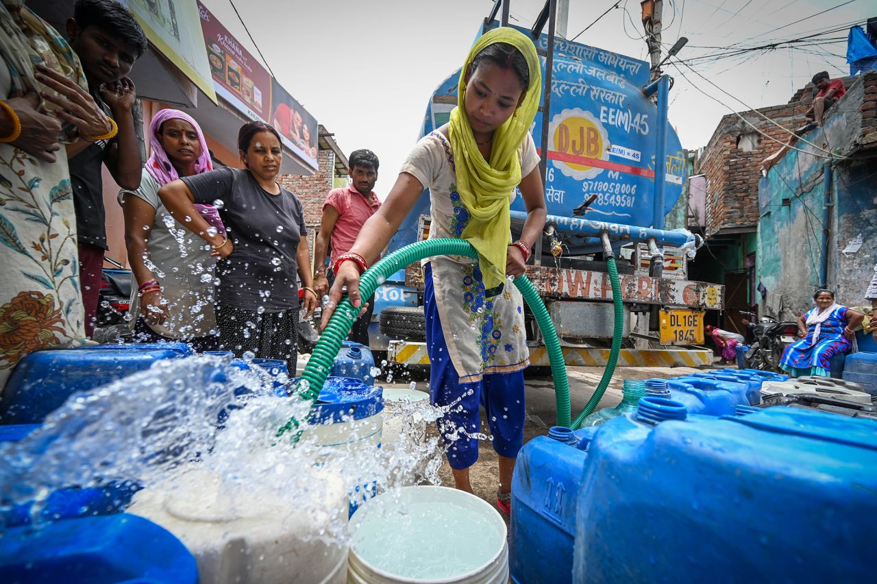 People seen filling water from a Delhi Jal Board Tanker amid water crises near Munirka, on June 1, in New Delhi, India. 