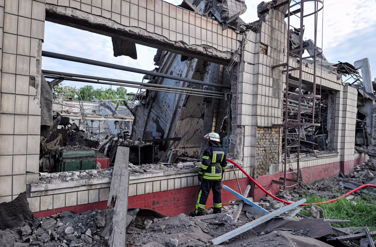 A fireman stands near the production shop of the Darnytsia Carriage Repair Plant in Kyiv, Ukraine on June 5.  