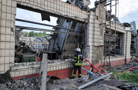 A fireman stands near the production shop of the Darnytsia Carriage Repair Plant in Kyiv, Ukraine on June 5.  