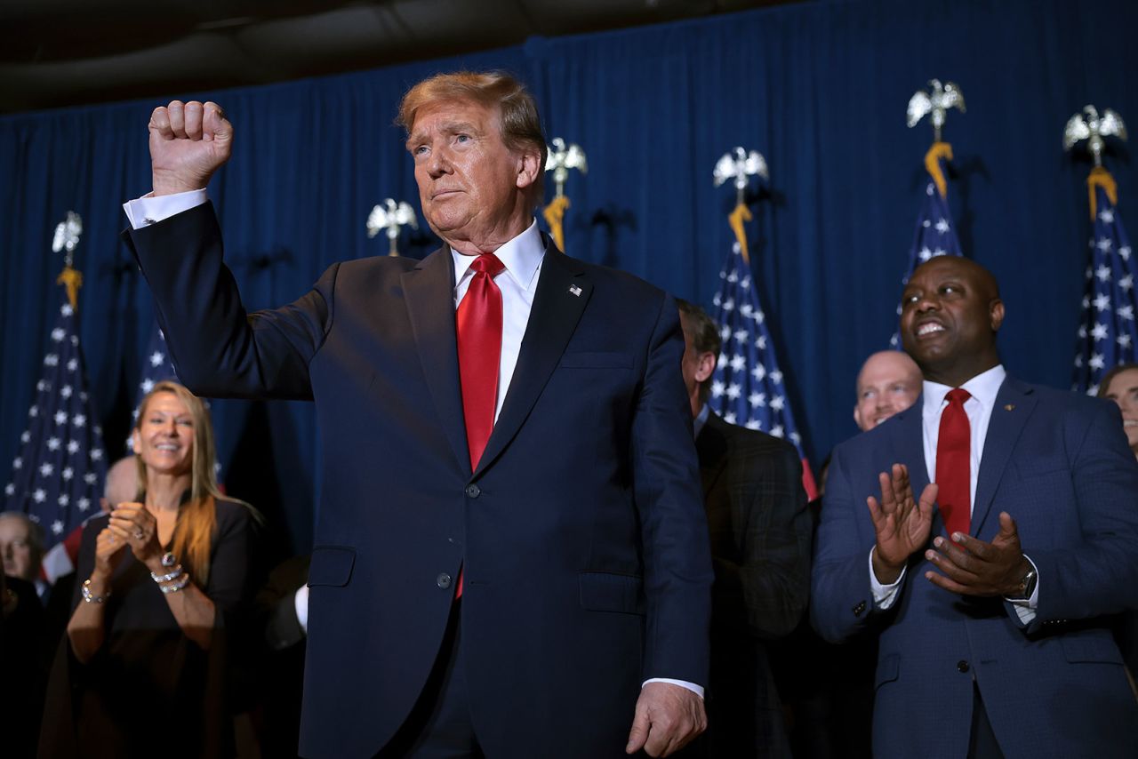 Republican presidential candidate and former President Donald Trump gestures to supporters during an election night watch party at the State Fairgrounds on February 24,  in Columbia, South Carolina. 