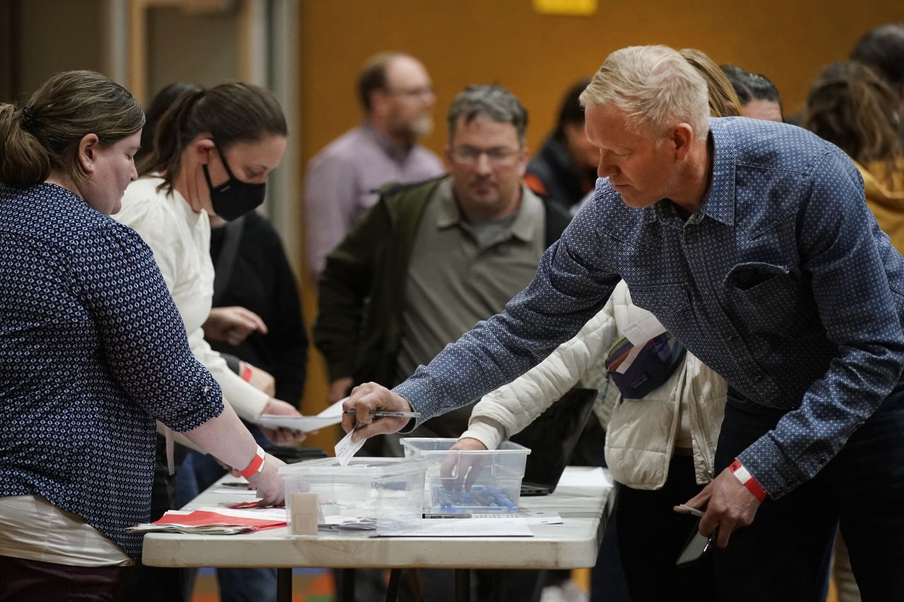 A voter casts his choice for the Republican presidential candidate on a slip of paper during the Republican Caucasus at Wasatch Elementary school in Provo, Utah on Super Tuesday, March 5.