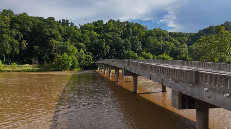 The bridge spanning the French Broad River – looking from Marshall, North Carolina, across to Blannahassett Island. The post-Helene floodwaters rose over the bridge.