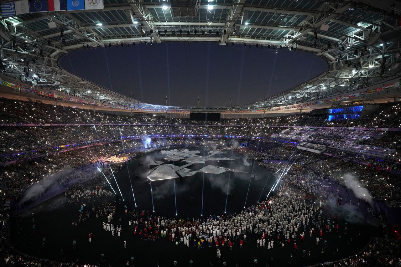 The lights go down at the Stade de France. 