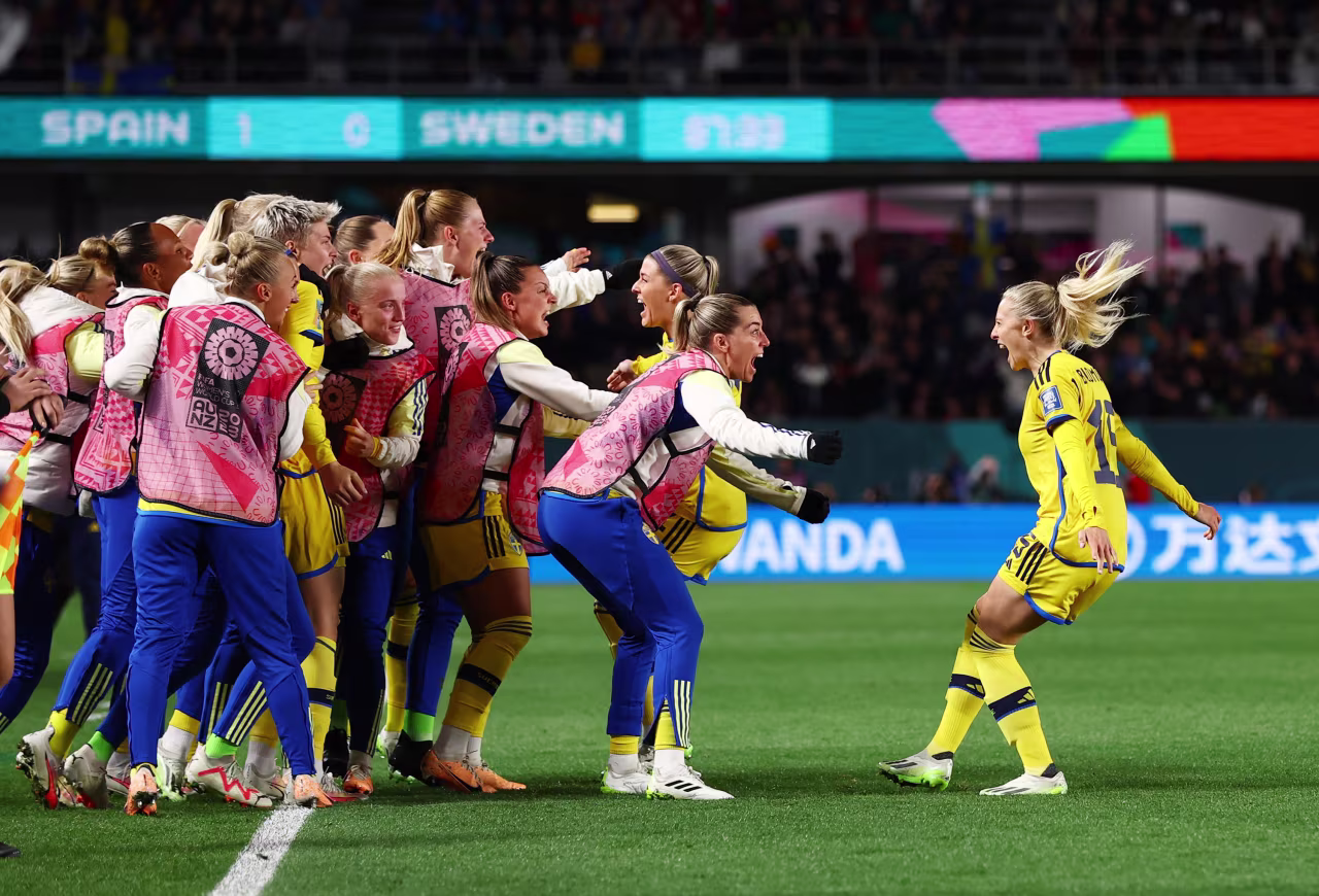 Sweden's Rebecka Blomqvist celebrates scoring their first goal with teammates.