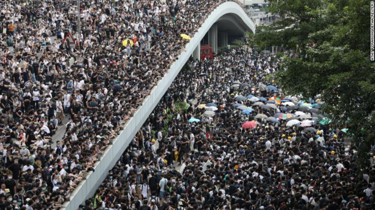 Protesters march along Harcourt Road and Connaught Road Central.