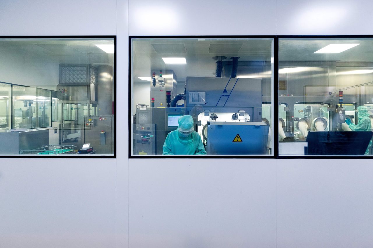 People work at a Sanofi facility in Val-de-Reuil, France, on July 10.