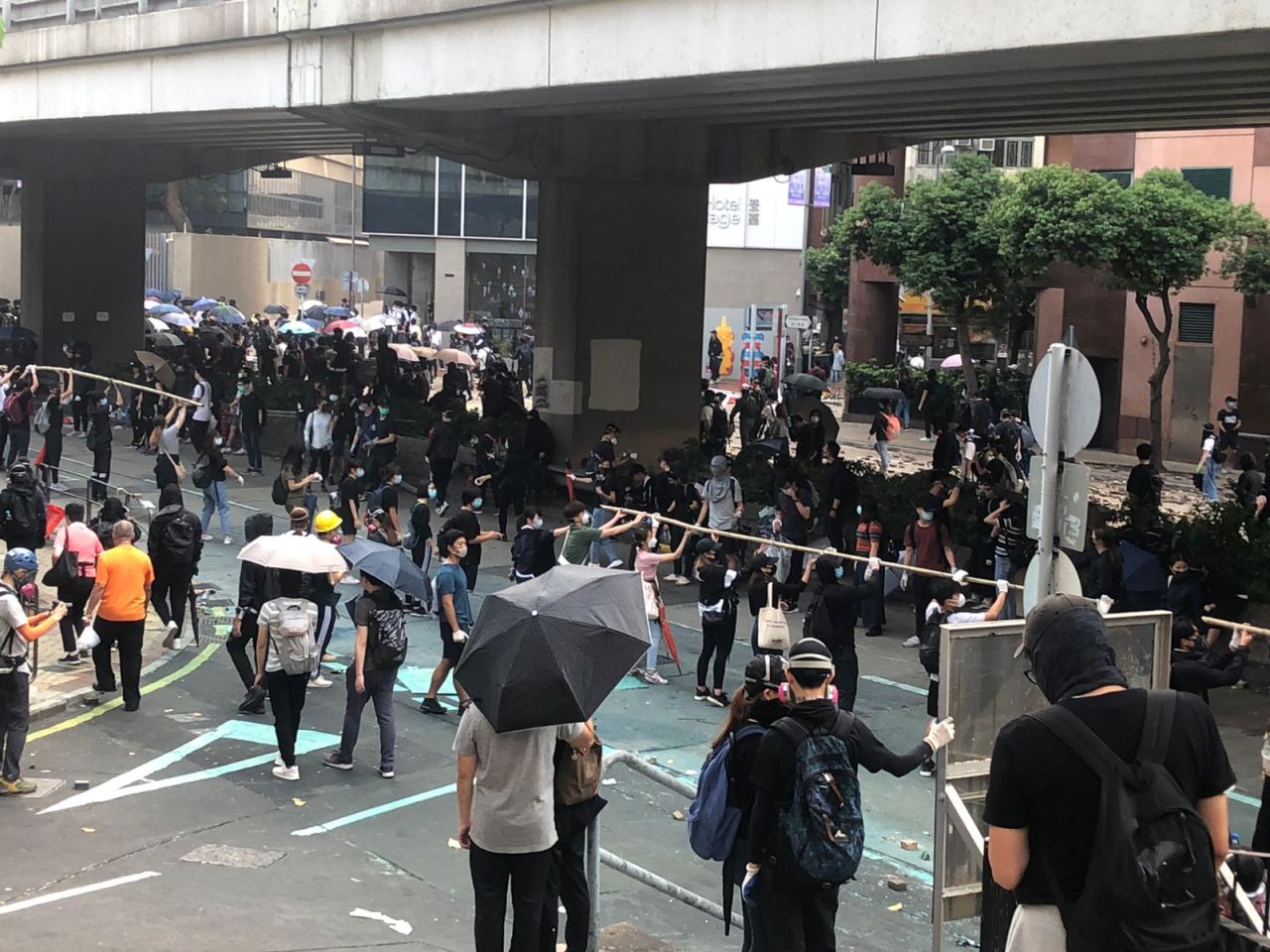 Protesters form a human chain to pass along supplies in Kowloon, Hong Kong, on November 18, 2019.