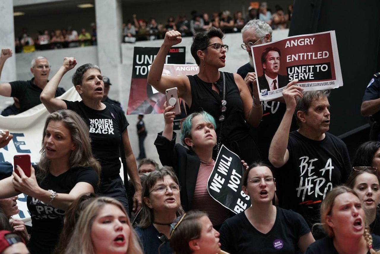 Activists shout slogans during a protest against the confirmation of Supreme Court nominee Judge Brett Kavanaugh October 4, 2018 at the Hart Senate Office Building on Capitol Hill in Washington, DC.