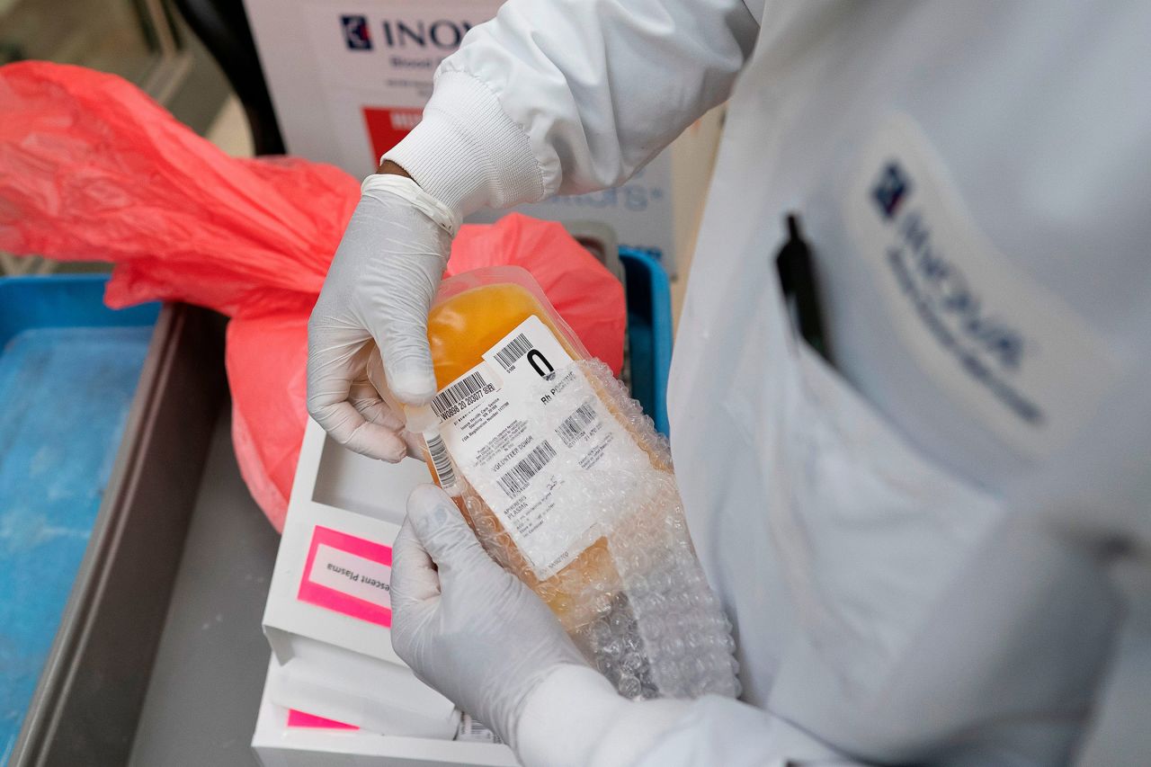 A lab technician packs donated convalescent plasma for shipping to local hospitals on April 22, 2020, in Dulles, Virginia. 