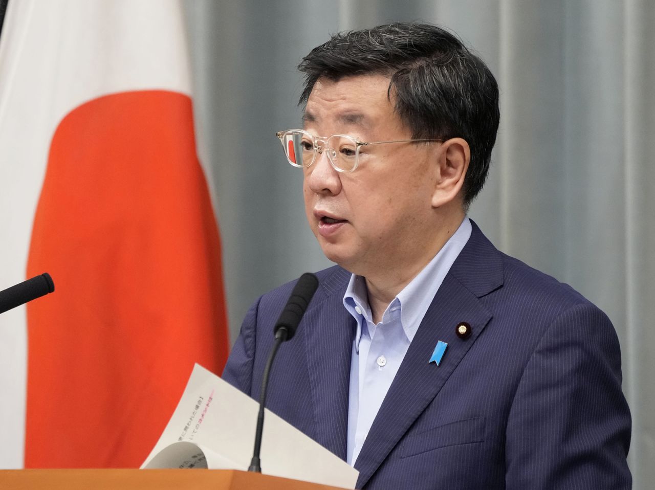 Japanese Chief Cabinet Secretary Hirokazu Matsuno attends a news conference in Tokyo on August 24.