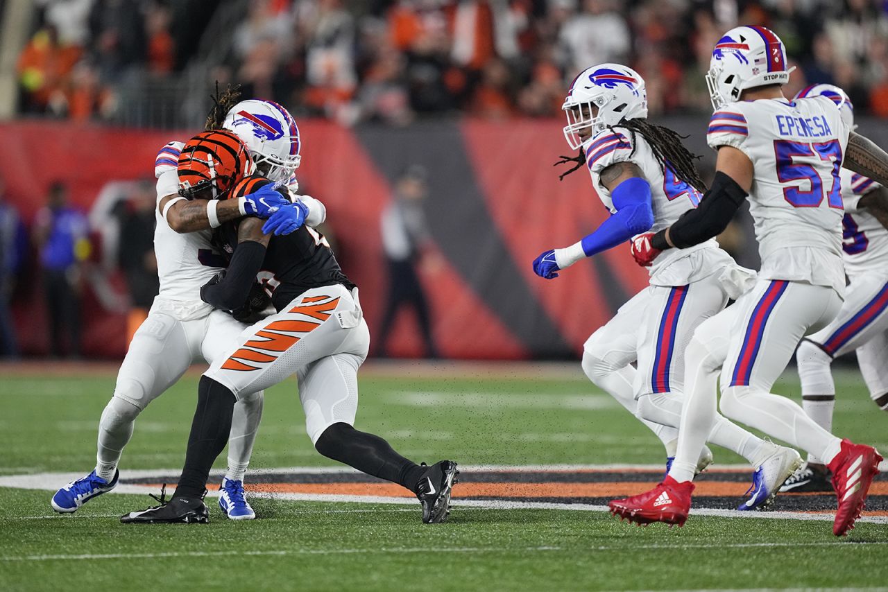 Damar Hamlin #3 of the Buffalo Bills tackles Tee Higgins #85 of the Cincinnati Bengals.