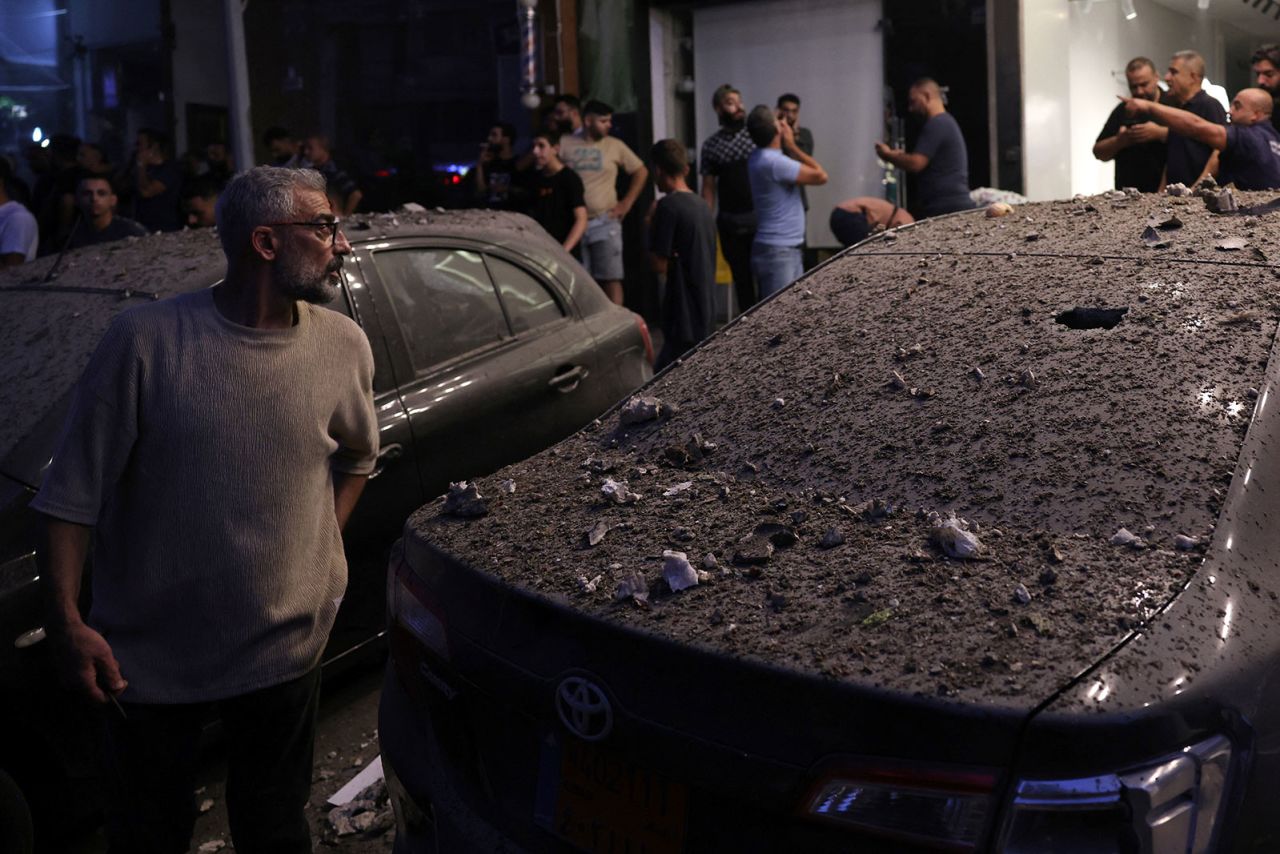 Debris covers a damaged vehicle following an Israeli military strike on Beirut's southern suburbs on July 30.