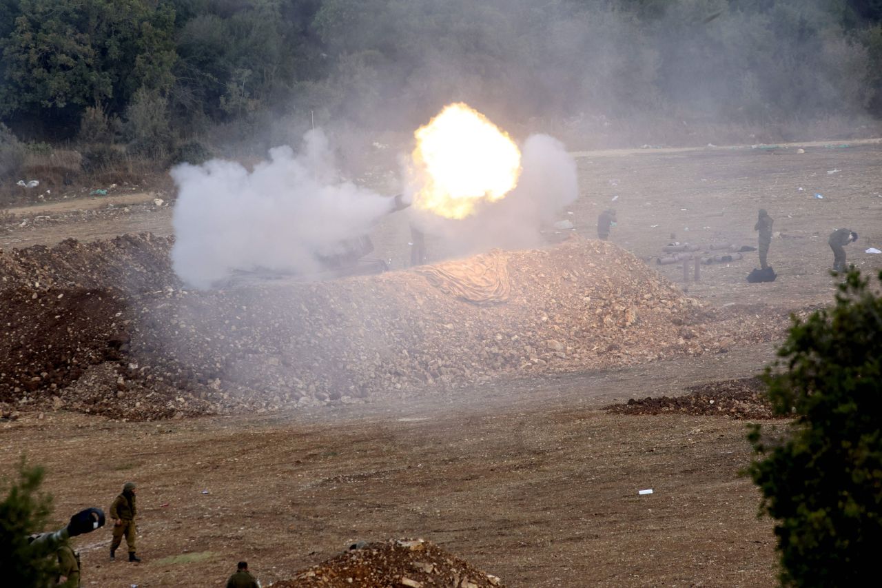 Israeli forces launch artillery fire towards southern Lebanon from the border zone in northern Israel on October 9, 2023.