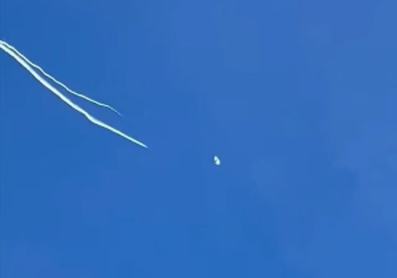 A still from Joey Lopes' video of the balloon being shot down Saturday, February 4. 