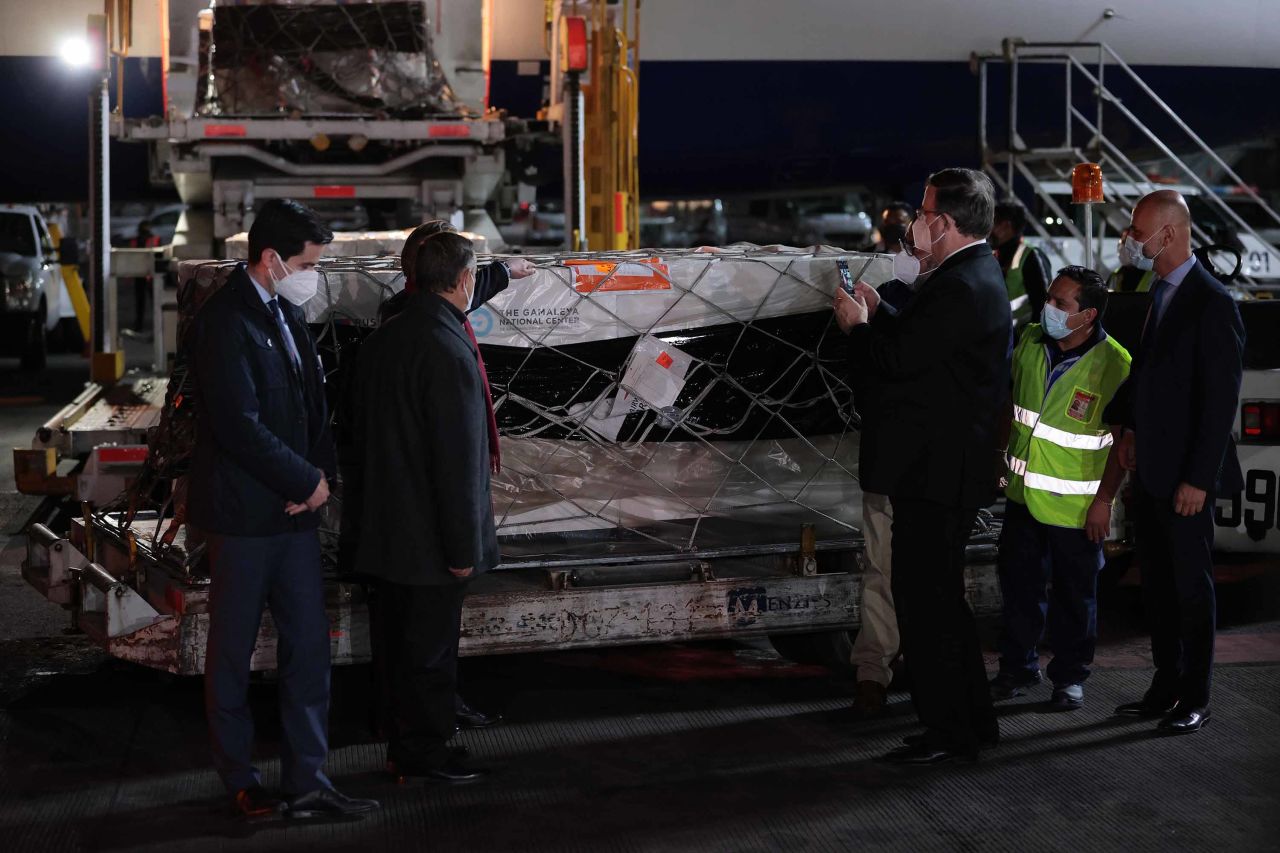 Viktor Koronelli, Russian ambassador in Mexico, and Marcelo Ebrard, Mexico's secretary of Foreign Affairs, with a container carrying the Sputnik V vaccine at Benito Juarez International Airport in Mexico City, on Monday.