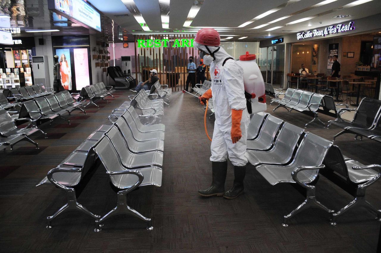 Officials spray disinfectant at Halim Perdanakusuma Airport in Jakarta, Indonesia on March 18.