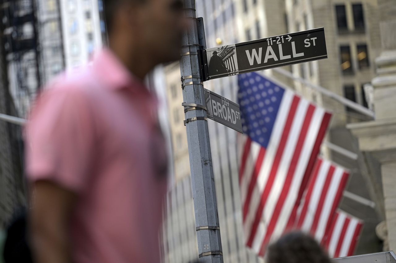 A person walks along Wall Street near the New York Stock Exchange on September 3.