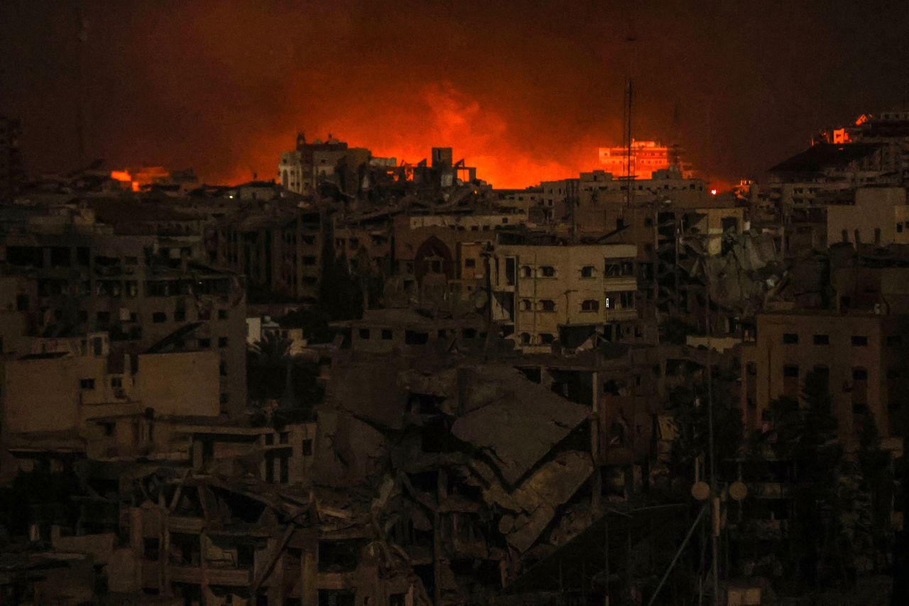 Flames and smoke rise over Gaza City after Israeli airstrikes on October 30.