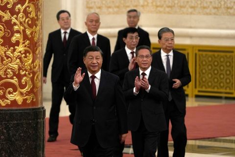 New members of the Politburo Standing Committee arrive at the Great Hall of the People in Beijing on Sunday. 