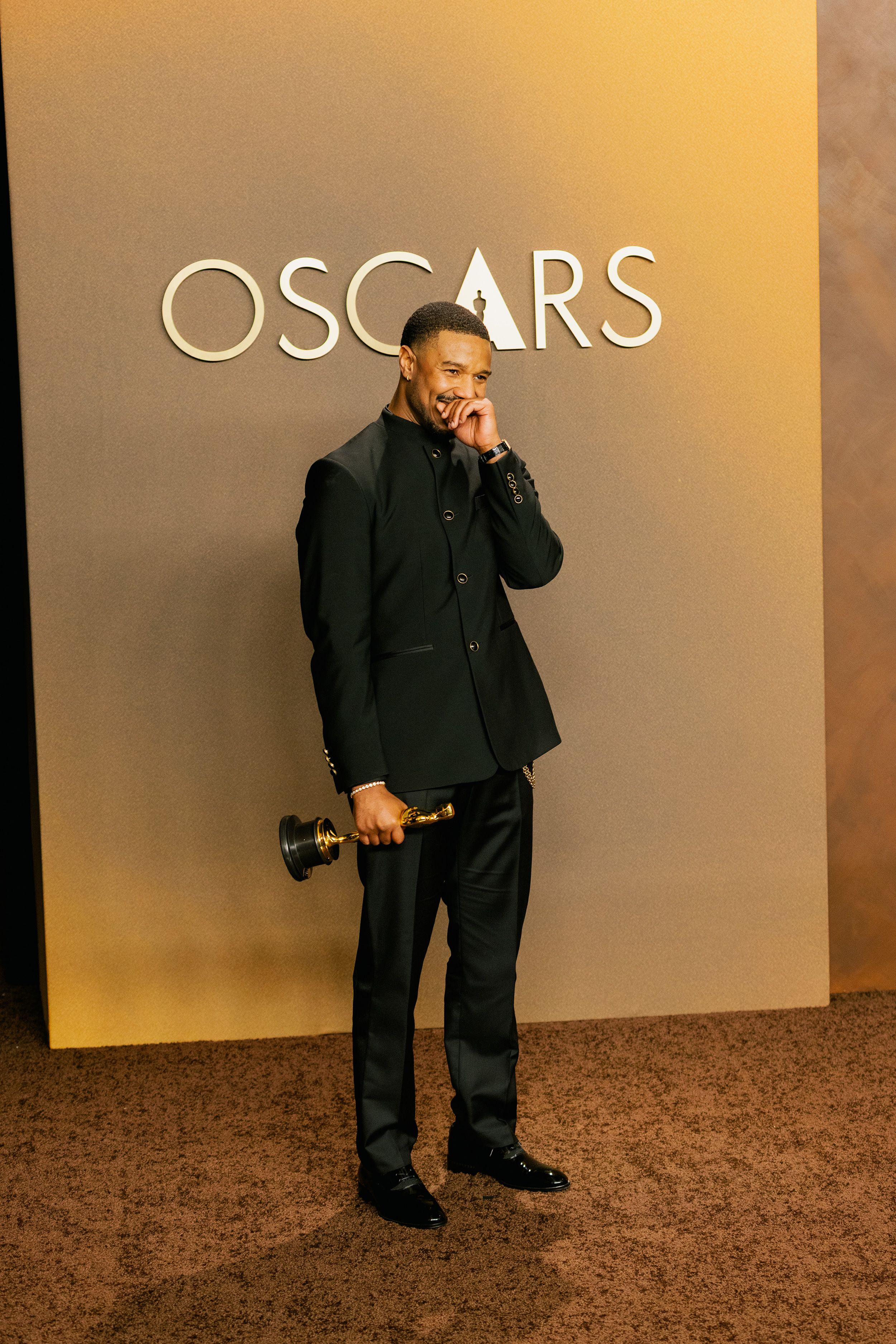 “Sinners” star Michael B. Jordan, with his Academy Award for best actor, takes it all in.