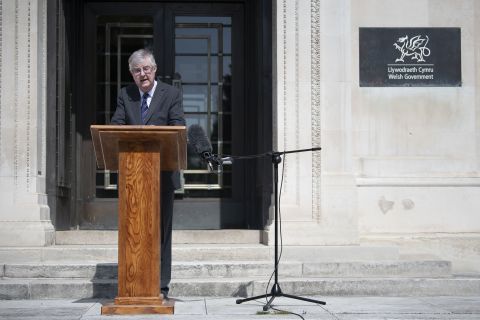 First Minister of Wales Mark Drakeford speaks to the press outside the Welsh Government building in Cardiff, Wales, on May 8. 