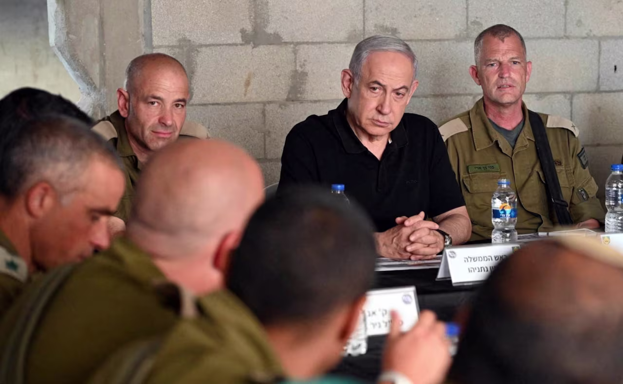 Israeli Prime Minister Benjamin Netanyahu meets with soldiers as he visits an army base in Tze'elim, Israel, on November 7.