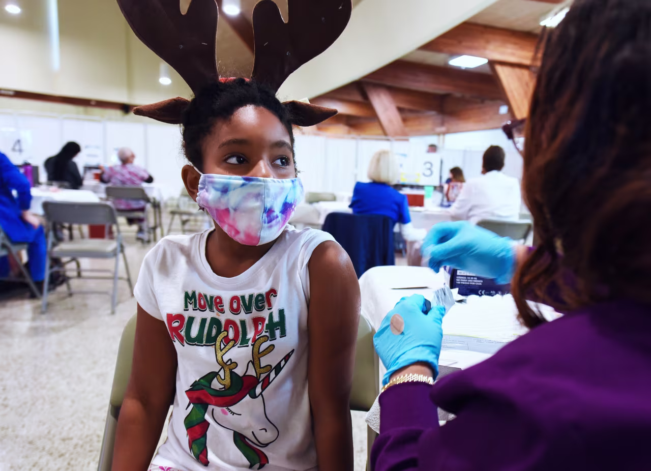 A health worker prepares to administer a dose of Pfizer covid-19 vaccine at the Sanford Civic Center in Sanford, Florida, in early December. 