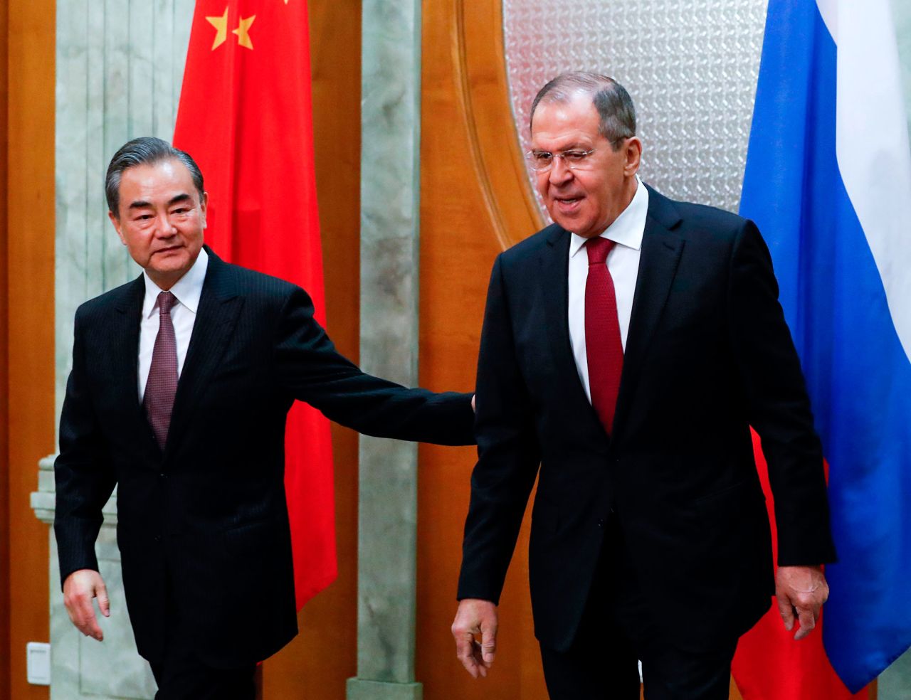 In this file photo, Russian Foreign Minister Sergei Lavrov, right, meets with his Chinese counterpart Wang Yi in Sochi on May 13, 2019. 