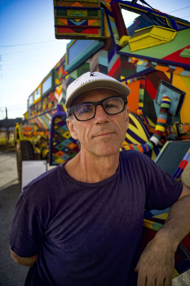 Artist Ralph Ziman poses next to his repurposed Casspir vehicle.