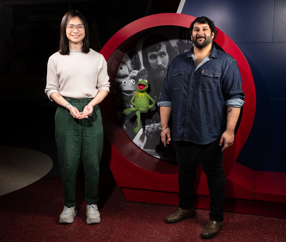 Authors of the new paper, Calvin So (left) and Arjan Mann (right), named the prehistoric amphibian after Kermit the Frog. The Muppet icon is photographed in the Entertainment Nation exhibition at Smithsonian's National Museum of American History.