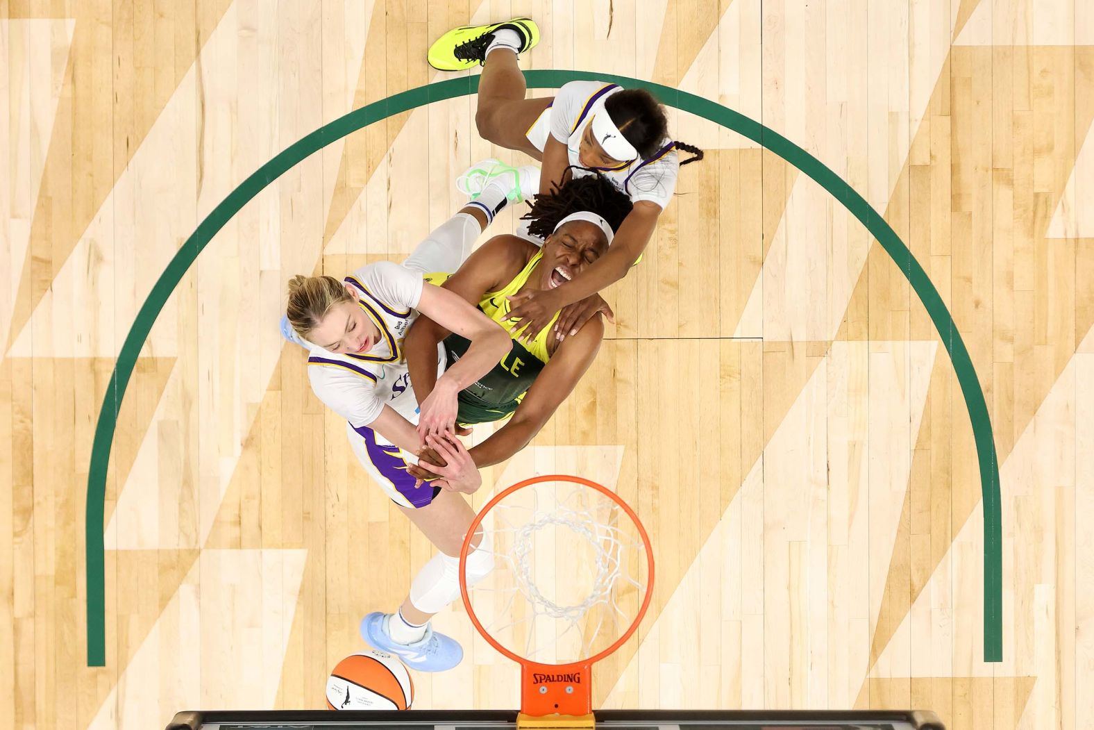 The Seattle Storm’s Nneka Ogwumike, center, battles Cameron Brink, left, and Rickea Jackson for a rebound during a WNBA game against the Los Angeles Sparks on Monday, September 1.