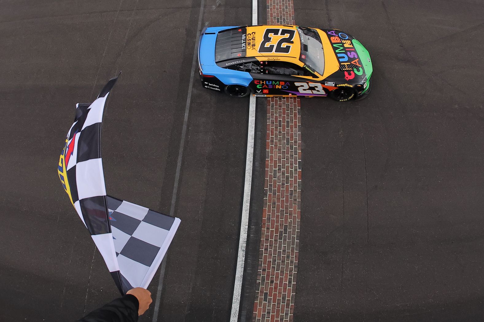 NASCAR driver Bubba Wallace takes the checkered flag as <a href="index.php?page=&url=https%3A%2F%2Fwww.cnn.com%2F2025%2F07%2F27%2Fsport%2Fbubba-wallace-first-black-driver-win-indianapolis-spt">he wins the Brickyard 400</a> at the Indianapolis Motor Speedway on Sunday, July 27. Wallace is the first Black driver to win a major race at the iconic track.