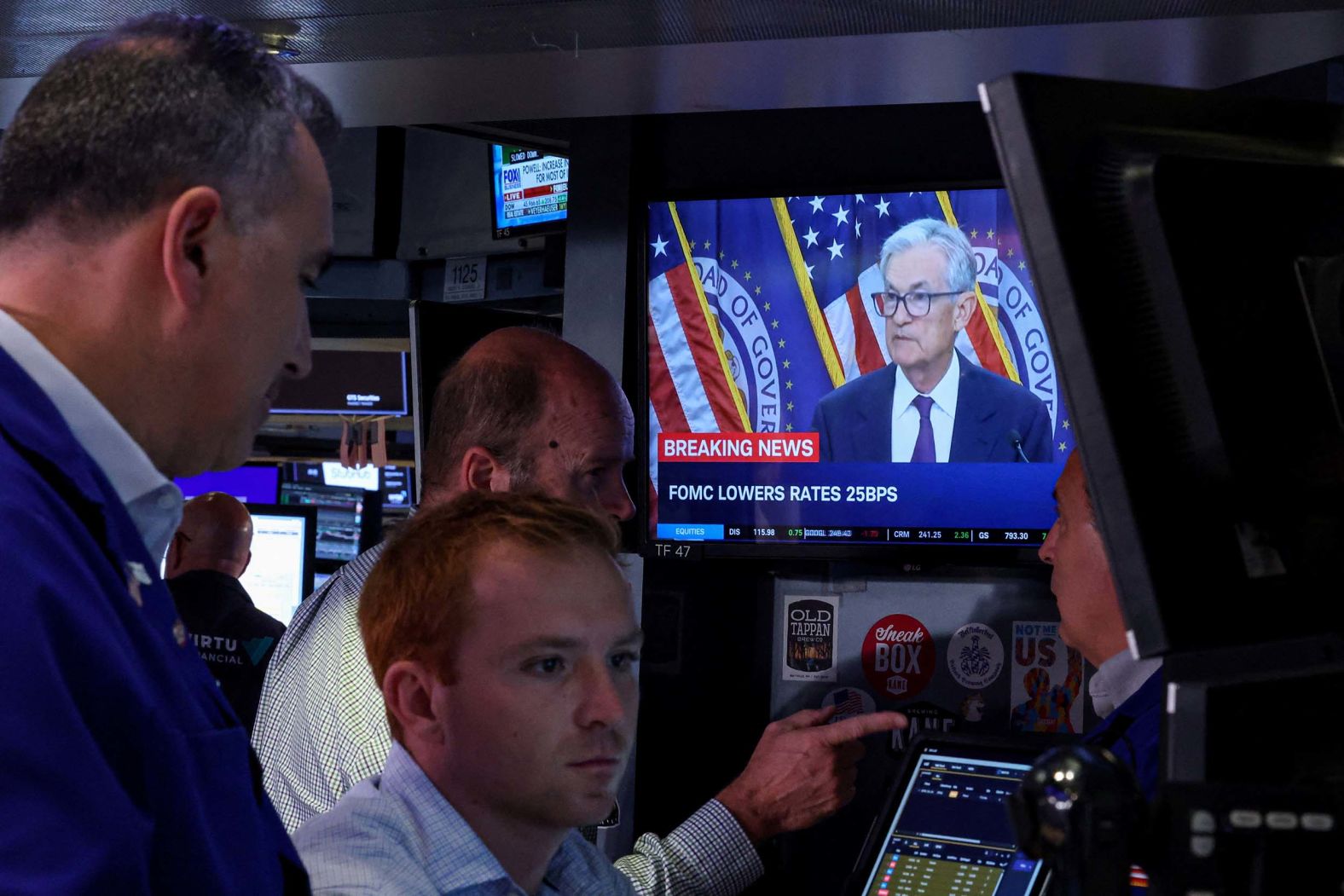 Traders work at the New York Stock Exchange as a TV screen shows Federal Reserve Chair Jerome Powell on Wednesday, September 17. <a href="index.php?page=&url=https%3A%2F%2Fwww.cnn.com%2Fbusiness%2Flive-news%2Ffederal-reserve-interest-rate-09-17-25">The Fed cut its benchmark interest rate for the first time since December</a> and signaled more cuts are likely this year.