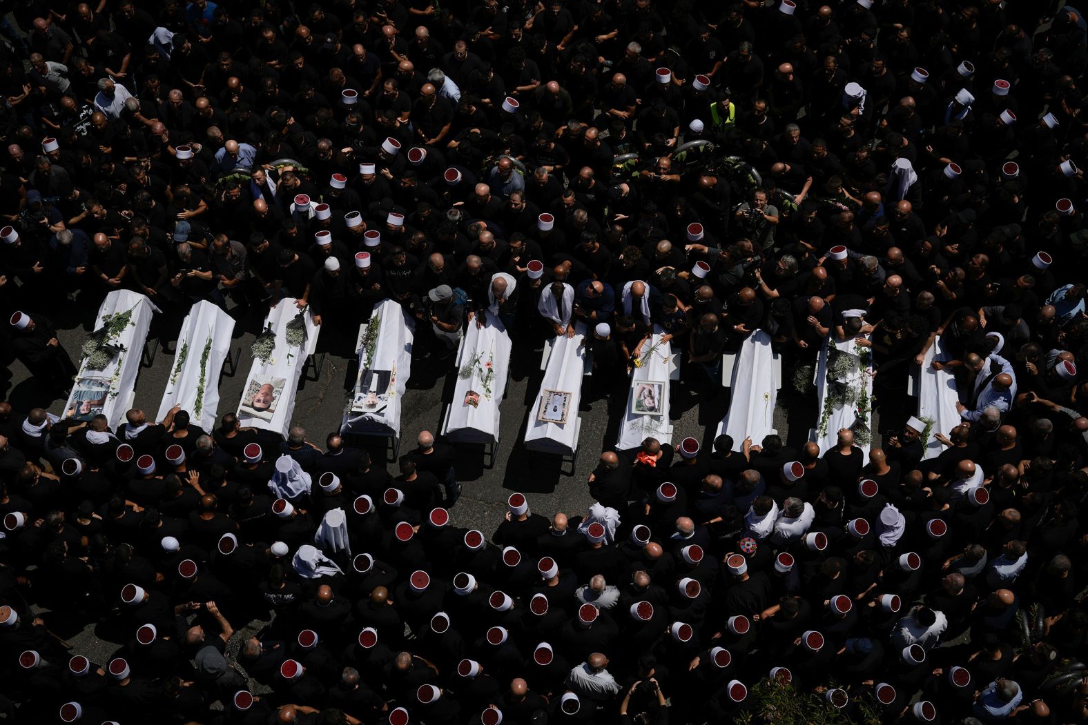 Members of the Druze community mourn <a href="index.php?page=&url=https%3A%2F%2Fwww.cnn.com%2F2024%2F07%2F28%2Fmiddleeast%2Fisrael-hezbollah-golan-heights-soccer-strikes-intl%2Findex.html">12 children who were killed</a> when a rocket hit a village in the Israeli-controlled Golan Heights on Saturday, July 27. Israel blamed the Lebanese militant group Hezbollah for the attack. Hezbollah firmly denied it was behind the rocket attack, the deadliest to hit Israel or Israeli-controlled territory since the October 7 attacks. On Tuesday, <a href="index.php?page=&url=https%3A%2F%2Fwww.cnn.com%2F2024%2F07%2F30%2Fmiddleeast%2Fbeirut-explosion-hezbollah-stronghold-intl-latam">Israel said it had killed Hezbollah’s most senior military commander</a> in a strike in Beirut, Lebanon.