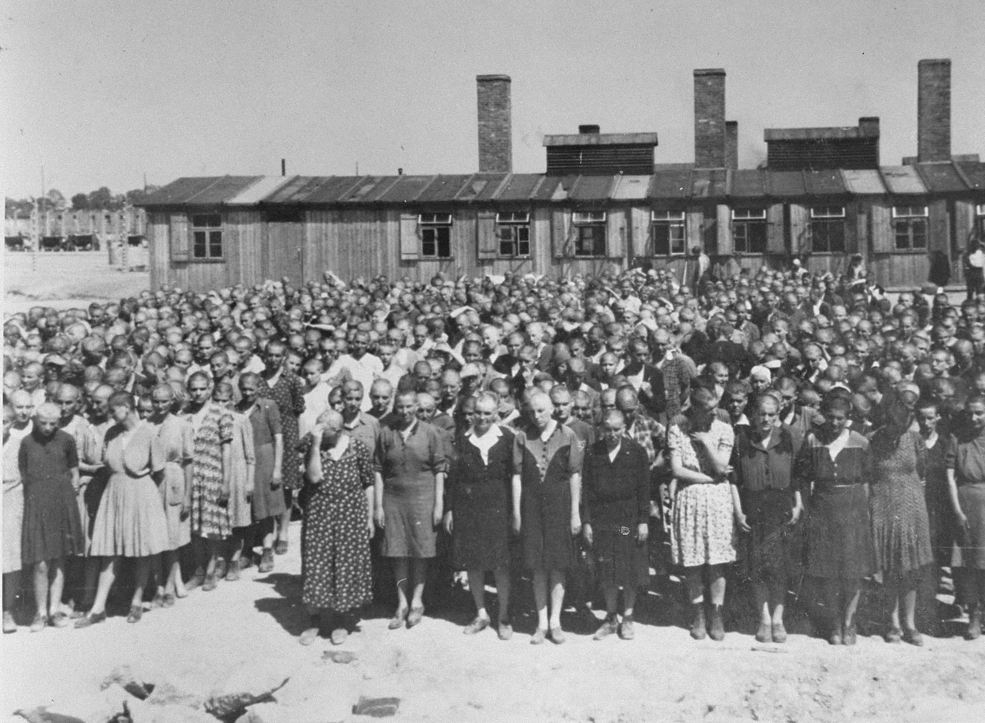 Jewish women selected for forced labor stand at a roll call in front of the kitchen at Auschwitz-Birkenau in May 1944.