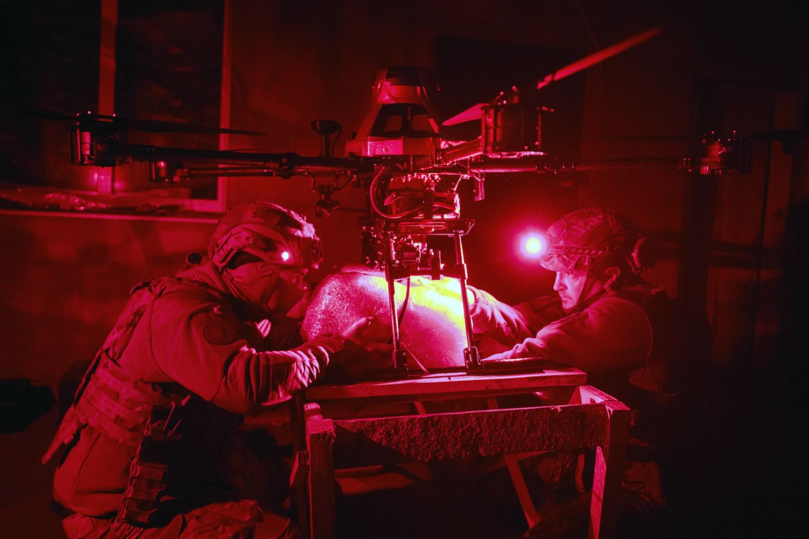Ukrainian servicemen attach a food package to a drone so that it can be delivered to fellow soldiers on the front line near Kharkiv, Ukraine, on Thursday, November 7.