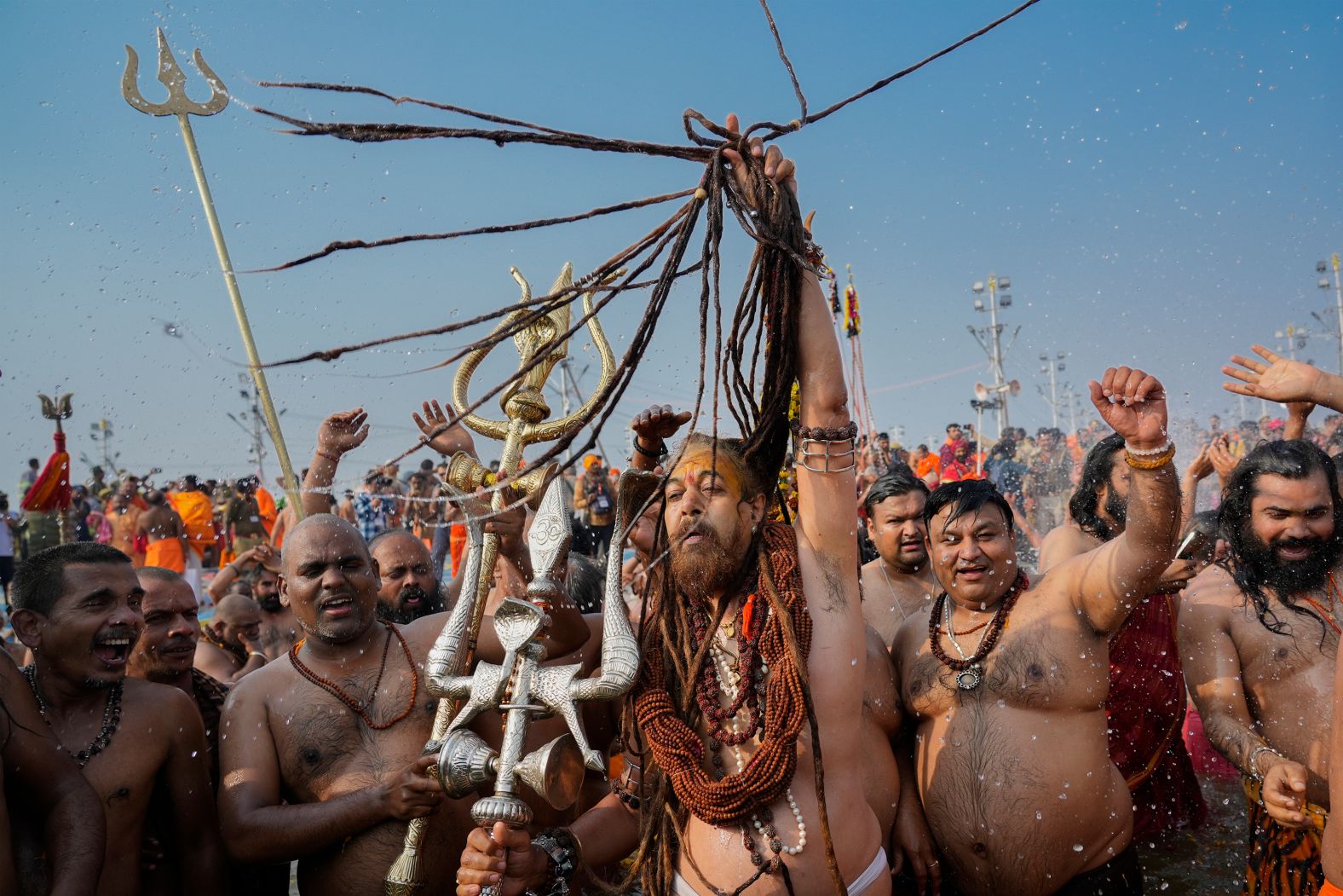 Hindu holy men take a dip in the Triveni Sangam, the confluence of three holy rivers, during the Maha Kumbh Mela festival in Prayagraj, India, on Wednesday, January 29.