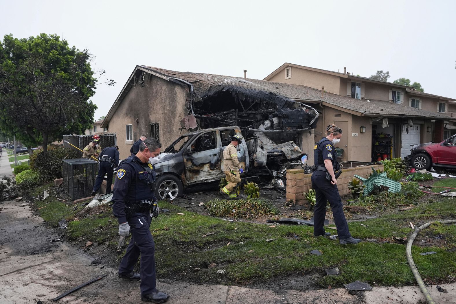 Authorities work at the scene where a small business jet <a href="https://www.cnn.com/2025/05/22/us/san-diego-plane-crash">crashed into a San Diego neighborhood</a> on Thursday, May 22. Investigators scoured the area for clues as to what caused the plane to crash. Multiple people were killed.